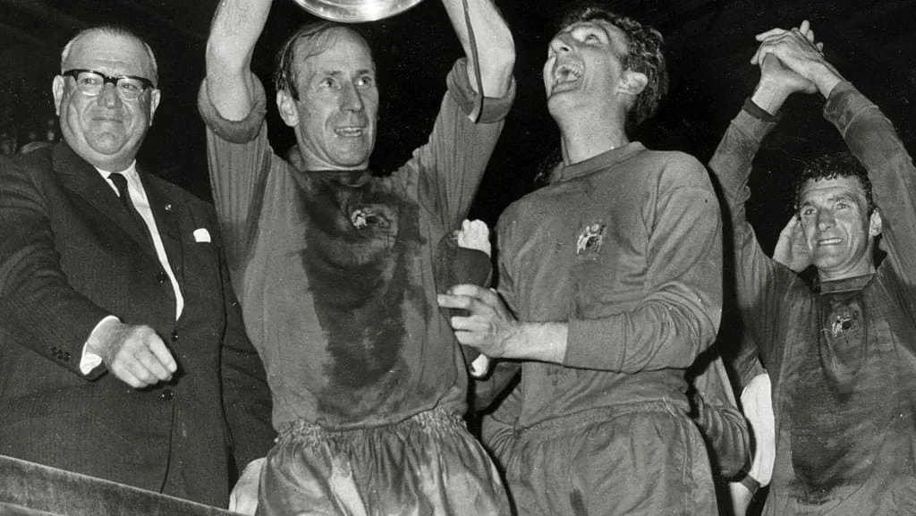Manchester United players celebrating their 1968 European Cup victory at Wembley